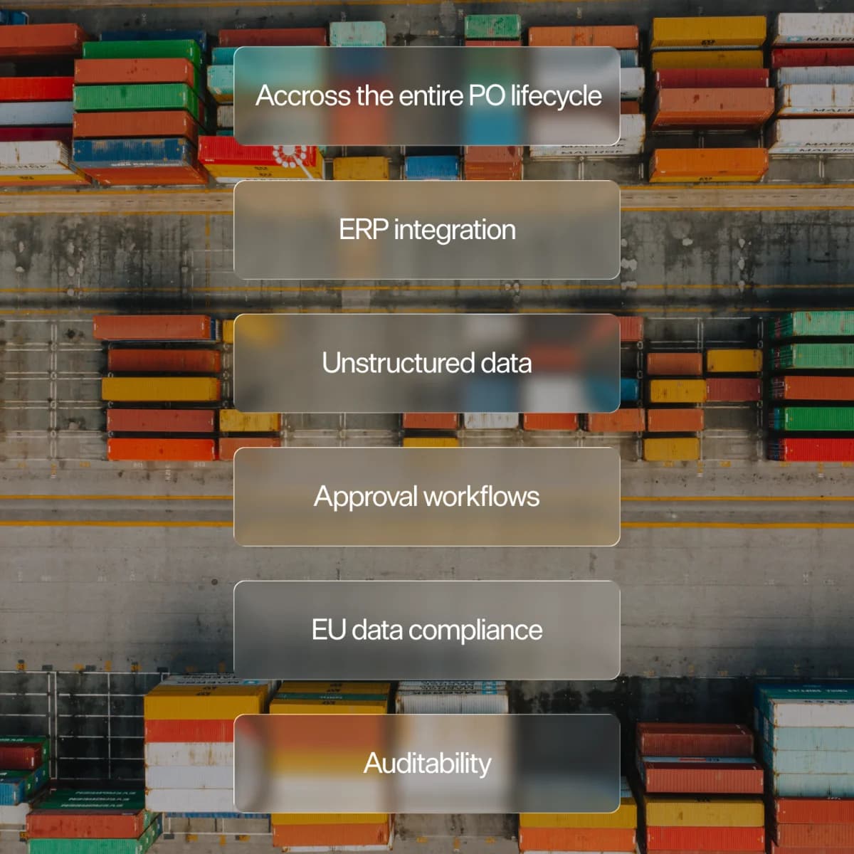 Warehouse worker reviewing purchase orders on a tablet beside stacked supplier shipments